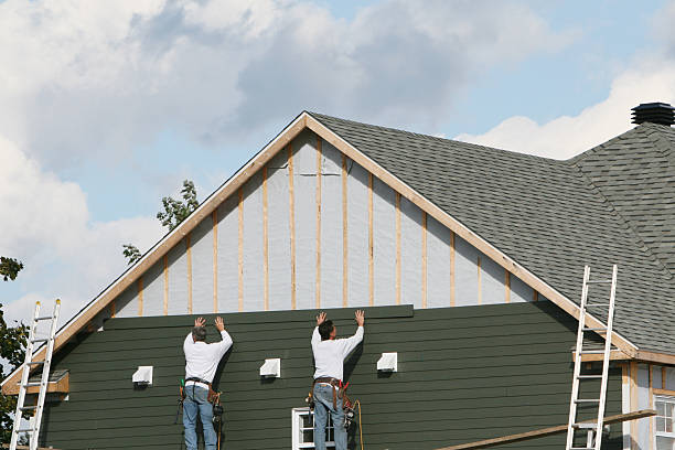 Professional Siding Installation technician working in Winchester, IN